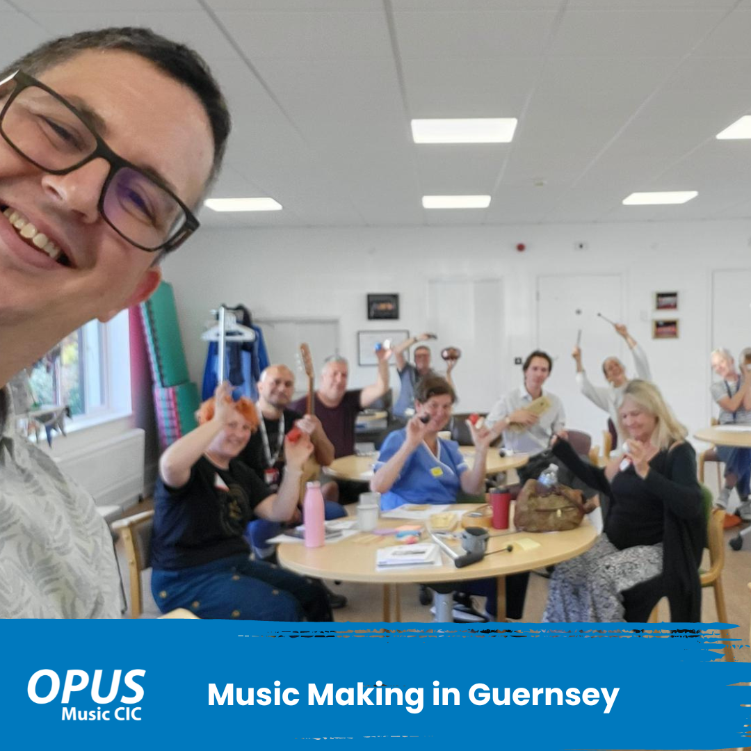 OPUS Music Nick in Guernsey with a room full of people