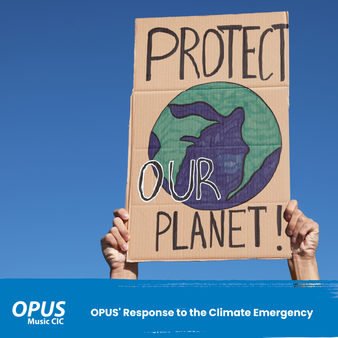 OPUS' Response to the Climate Emergency - sign that reads protect our planet with the Earth drawn