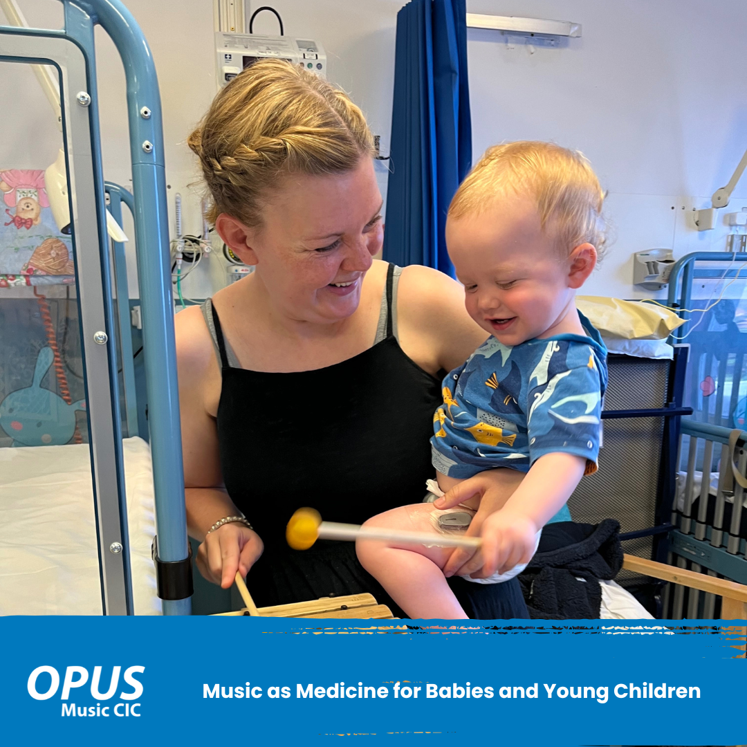 Music as Medicine for Babies and Young Children - photo of mother and child playing the glockenspiel smiling at each other