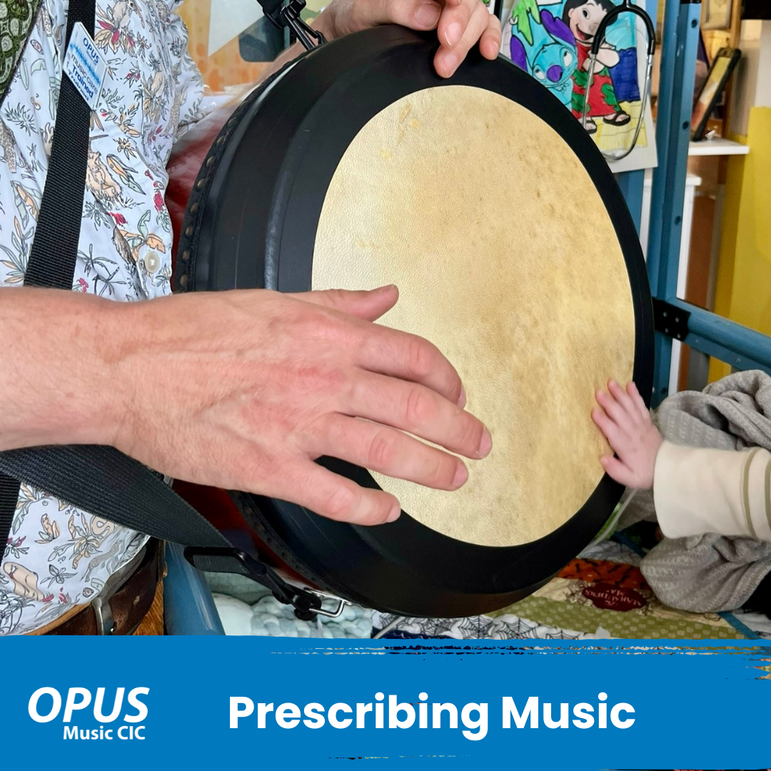 Prescribing music image of a bodhran and two hands playing in a hospital